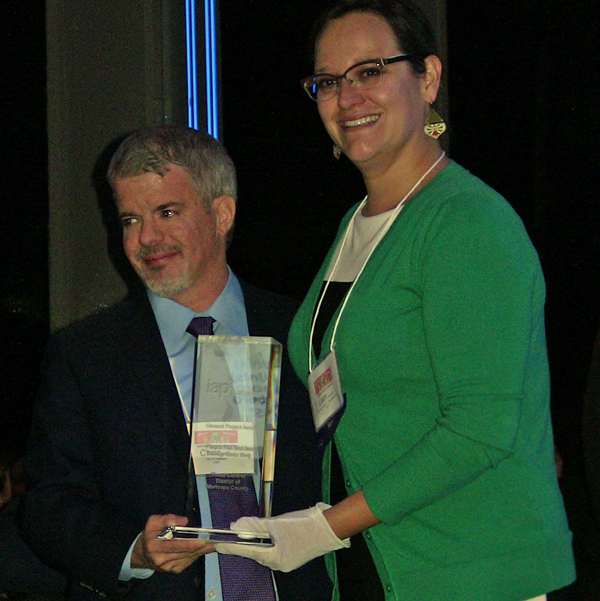 Chris Hartye (City of Hillsboro Oregon) receives the award for Organization of the Year from Leah